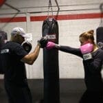 Woman and man boxing