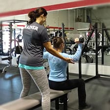 Personal trainer with client